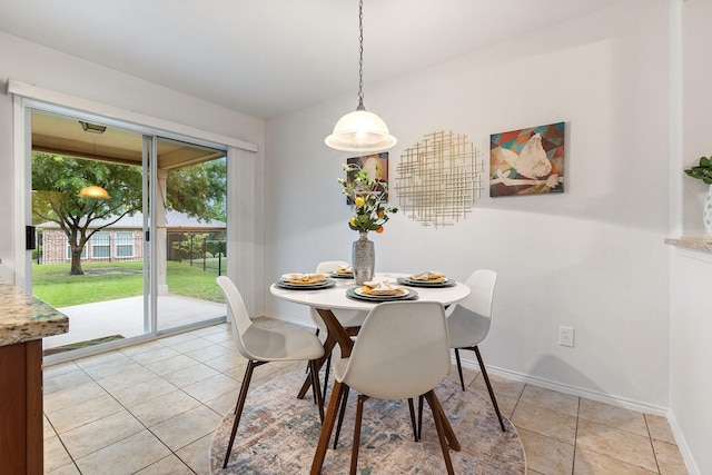 7735 Whirlwind Dr, Frisco, TX 75036 - dining room featuring baseboards and light tile patterned floors