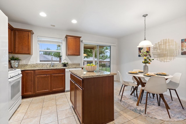 7735 Whirlwind Dr, Frisco, TX 75036 - kitchen with white appliances, a sink, a kitchen island, recessed lighting, and light stone countertops