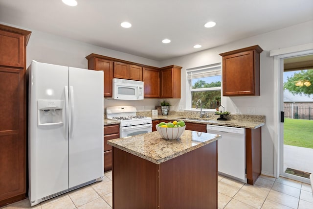 7735 Whirlwind Dr, Frisco, TX 75036 - kitchen with white appliances, a sink, light tile patterned flooring, a center island, and recessed lighting