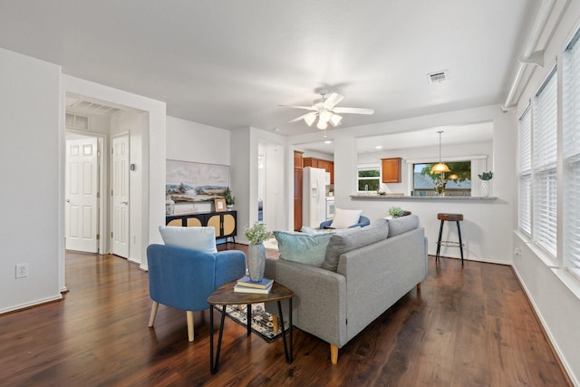 7735 Whirlwind Dr, Frisco, TX 75036 - living room featuring dark wood-style flooring, ceiling fan, and baseboards