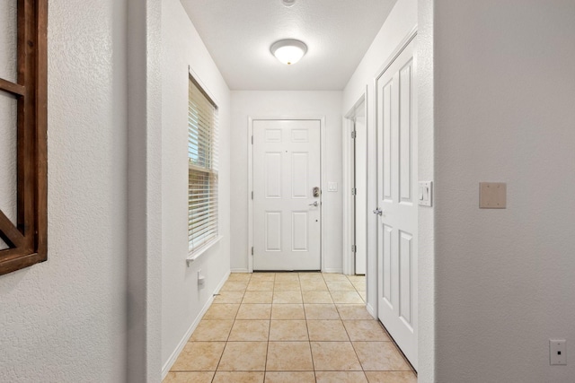 7735 Whirlwind Dr, Frisco, TX 75036 - corridor featuring light tile patterned floors and baseboards