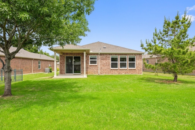7735 Whirlwind Dr, Frisco, TX 75036 - back of property featuring central air condition unit, brick siding, a patio, and a shingled roof