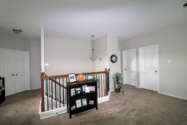 5516 Tama Dr, Waco, TX 76708 - hall featuring an upstairs landing, carpet flooring, and baseboards