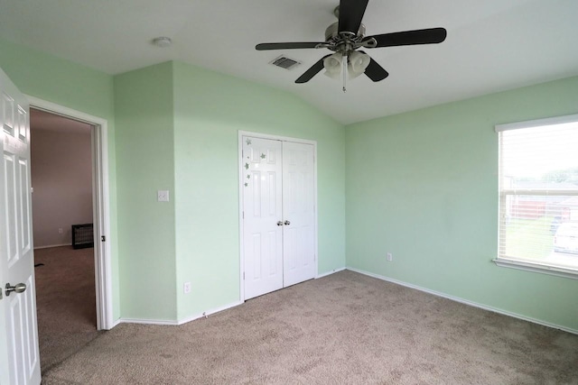 5516 Tama Dr, Waco, TX 76708 - unfurnished bedroom with carpet flooring, vaulted ceiling, baseboards, a closet, and a ceiling fan