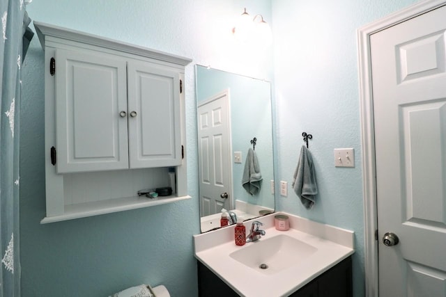 5516 Tama Dr, Waco, TX 76708 - bathroom with vanity and a textured wall