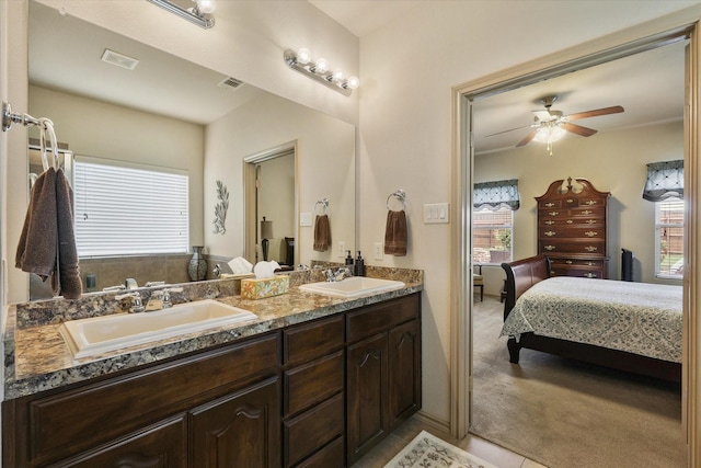 5139 Crystal Lake Ave, Krum, TX 76249 - full bathroom with connected bathroom, double vanity, and a ceiling fan