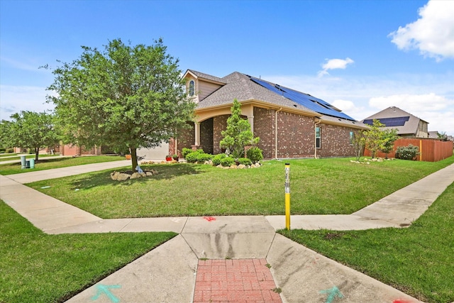 5139 Crystal Lake Ave, Krum, TX 76249 - view of front of house with brick siding, solar panels, and a shingled roof