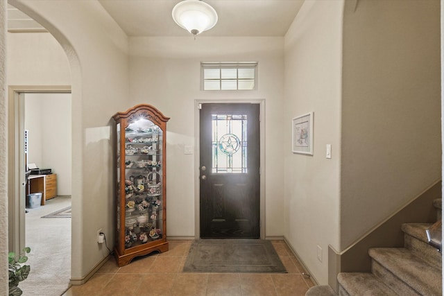 5139 Crystal Lake Ave, Krum, TX 76249 - tiled entrance foyer with arched walkways, baseboards, and stairs