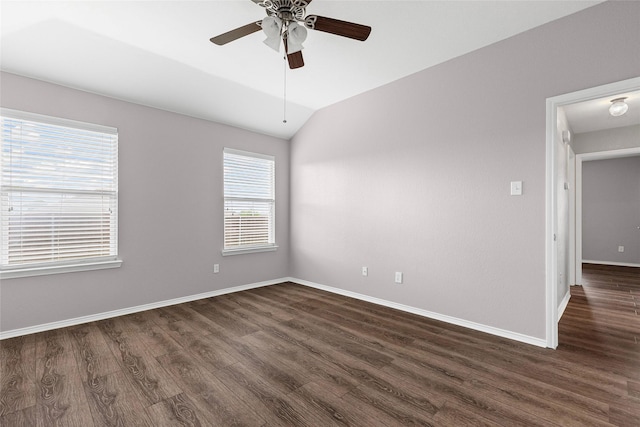 1502 Jacksons Run, Greenville, TX 75402 - spare room featuring dark wood-type flooring, lofted ceiling, ceiling fan, and baseboards