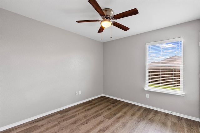1502 Jacksons Run, Greenville, TX 75402 - empty room featuring wood finished floors, baseboards, and a ceiling fan