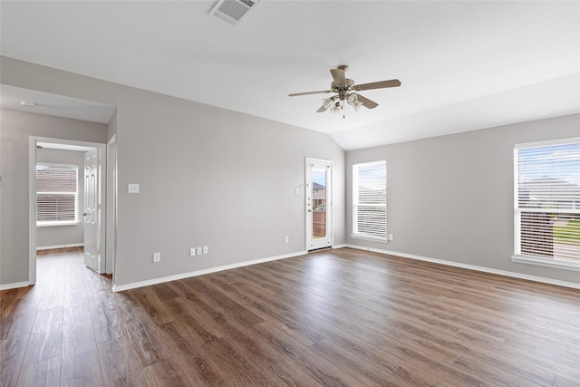 1502 Jacksons Run, Greenville, TX 75402 - spare room featuring dark wood finished floors, ceiling fan, baseboards, and lofted ceiling