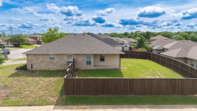 1502 Jacksons Run, Greenville, TX 75402 - view of home's exterior with a residential view, a shingled roof, and brick siding