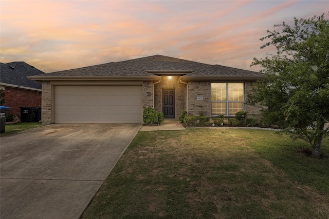 1502 Jacksons Run, Greenville, TX 75402 - view of front facade with driveway, a garage, a front yard, and brick siding