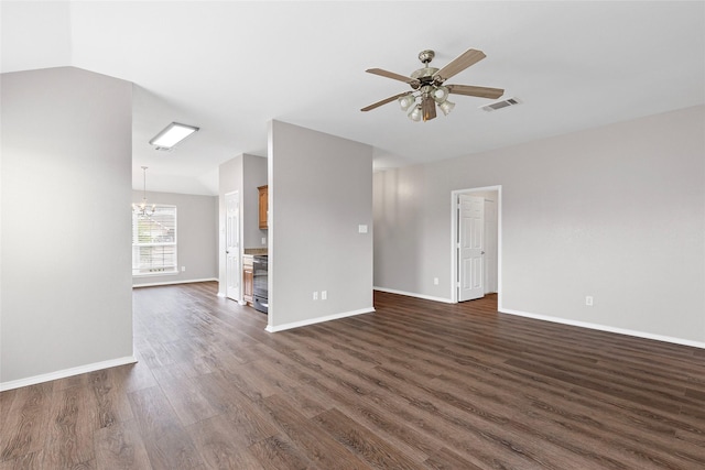 1502 Jacksons Run, Greenville, TX 75402 - unfurnished living room featuring a chandelier, dark wood-style flooring, ceiling fan, and baseboards