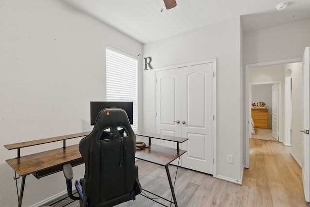 10957 Colonial Heights Ln, Fort Worth, TX 76179 - home office featuring light wood-style floors, ceiling fan, and baseboards