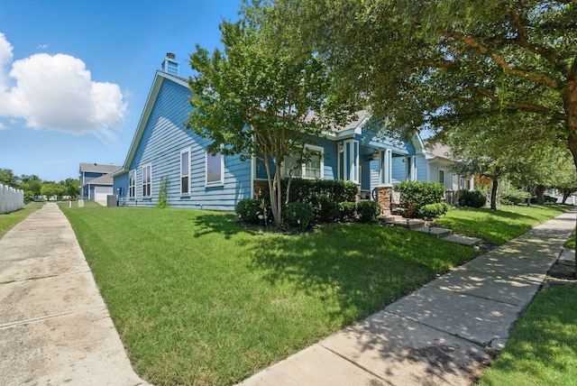 10957 Colonial Heights Ln, Fort Worth, TX 76179 - view of front of property with a front lawn and a chimney