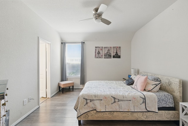 10957 Colonial Heights Ln, Fort Worth, TX 76179 - bedroom featuring light wood-style flooring, vaulted ceiling, baseboards, and ceiling fan