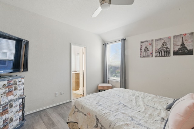10957 Colonial Heights Ln, Fort Worth, TX 76179 - bedroom with wood finished floors, lofted ceiling, baseboards, ceiling fan, and ensuite bath