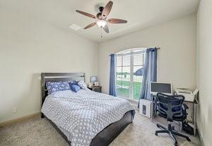 2575 Wincrest Dr, Rockwall, TX 75032 - carpeted bedroom featuring ceiling fan and a desk
