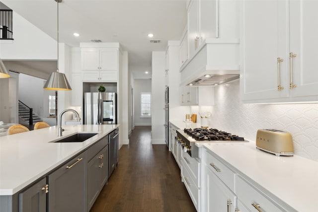 3411 Torrance Blvd, Frisco, TX 75034 - kitchen featuring a sink, stainless steel appliances, light countertops, white cabinets, and decorative backsplash