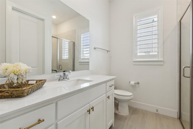 3411 Torrance Blvd, Frisco, TX 75034 - bathroom with baseboards, a shower stall, vanity, and toilet