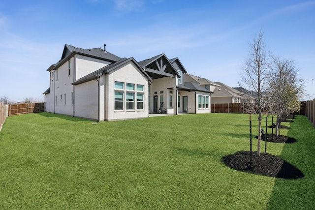 3411 Torrance Blvd, Frisco, TX 75034 - rear view of house featuring brick siding