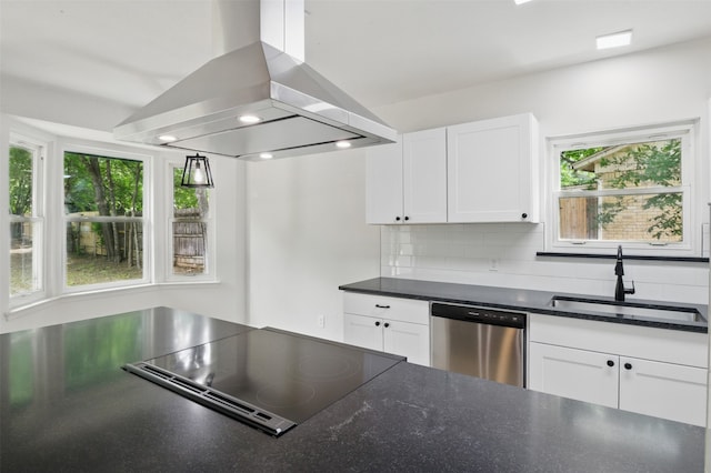 kitchen featuring island range hood, a sink, stainless steel dishwasher, stovetop with downdraft, and dark countertops