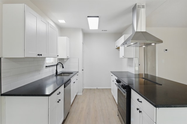 kitchen with a sink, island range hood, black range with electric stovetop, and dark countertops