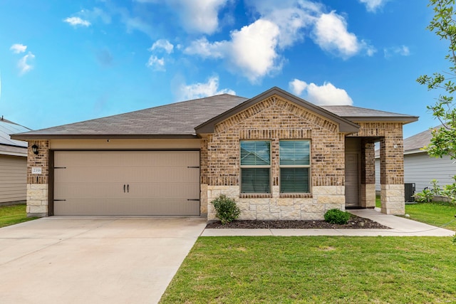 2358 Aylesbury Dr, Copperas Cove, TX 76522 - view of front of house featuring brick siding, an attached garage, driveway, and stone siding