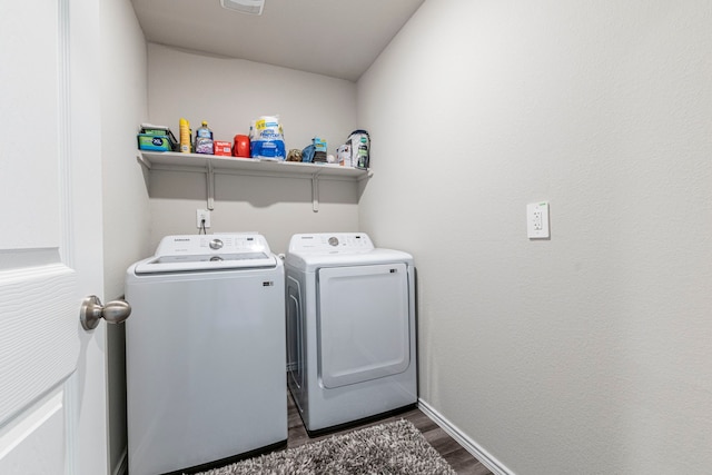 2358 Aylesbury Dr, Copperas Cove, TX 76522 - laundry room featuring washer and clothes dryer, dark wood-type flooring, and baseboards