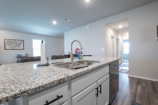 2358 Aylesbury Dr, Copperas Cove, TX 76522 - kitchen with a sink, stainless steel dishwasher, light stone counters, white cabinets, and plenty of natural light