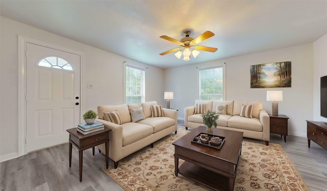 1107 Vine St, Weatherford, TX 76086 - living area featuring light wood finished floors, a ceiling fan, and baseboards