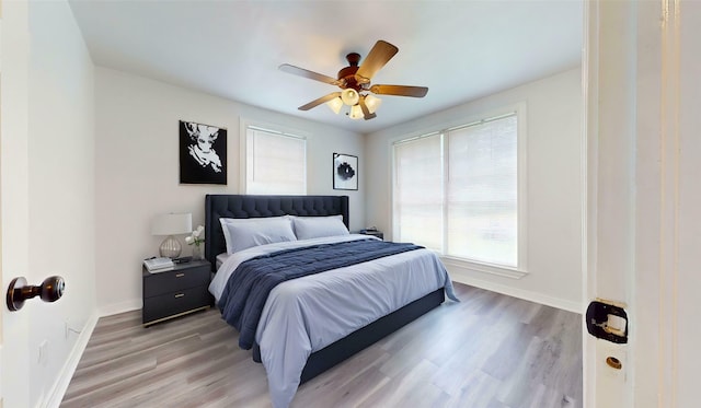 1107 Vine St, Weatherford, TX 76086 - bedroom with baseboards, light wood-style flooring, and ceiling fan