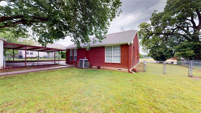 1107 Vine St, Weatherford, TX 76086 - rear view of property featuring brick siding, central AC unit, a gate, a carport, and roof with shingles