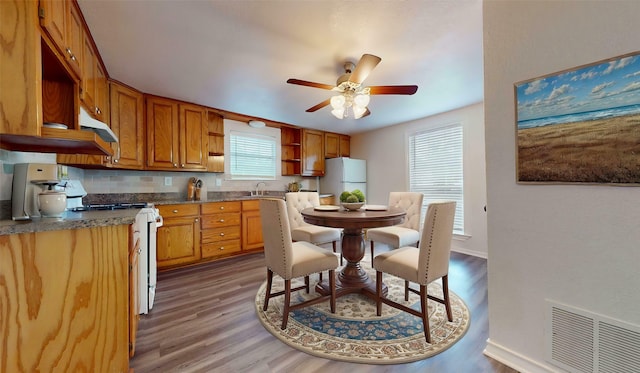 1107 Vine St, Weatherford, TX 76086 - kitchen featuring white appliances, open shelves, a sink, and plenty of natural light