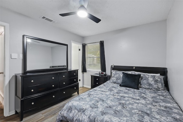 2433 Loyce Dr, Mesquite, TX 75149 - bedroom featuring wood finished floors, ceiling fan, and baseboards