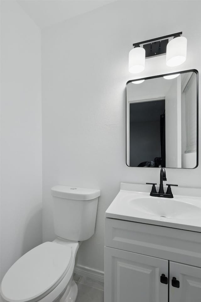 2433 Loyce Dr, Mesquite, TX 75149 - bathroom featuring toilet, vanity, baseboards, and tile patterned flooring