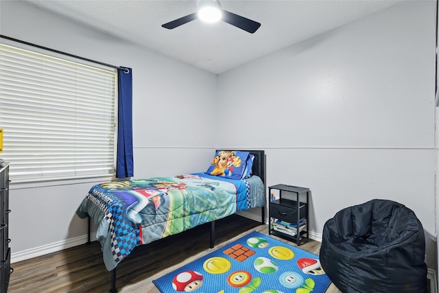 2433 Loyce Dr, Mesquite, TX 75149 - bedroom featuring wood finished floors, baseboards, and ceiling fan