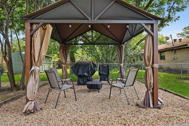 2433 Loyce Dr, Mesquite, TX 75149 - view of patio featuring a gazebo, fence, and area for grilling