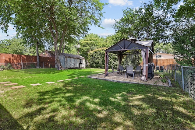 2433 Loyce Dr, Mesquite, TX 75149 - view of yard featuring a gazebo, a storage unit, an outdoor structure, and a patio area