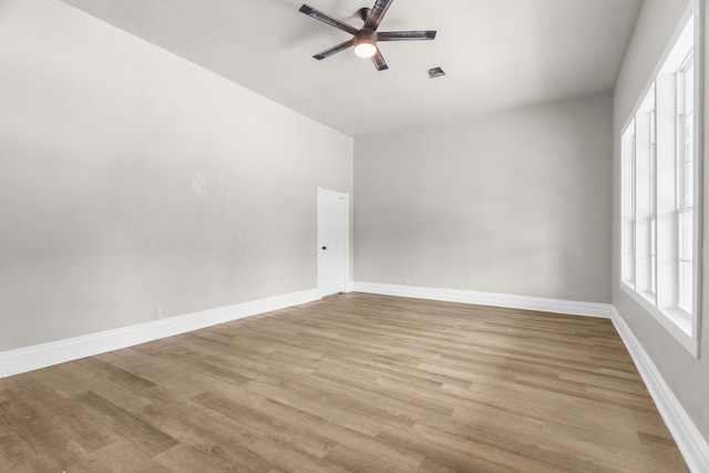 1315 E Pecan St, Gainesville, TX 76240 - spare room featuring a ceiling fan, light wood-style flooring, and baseboards