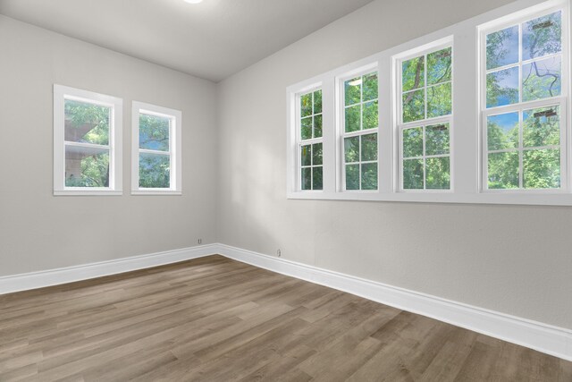 1315 E Pecan St, Gainesville, TX 76240 - empty room with baseboards and wood finished floors