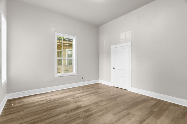 1315 E Pecan St, Gainesville, TX 76240 - unfurnished room with wood finished floors and baseboards