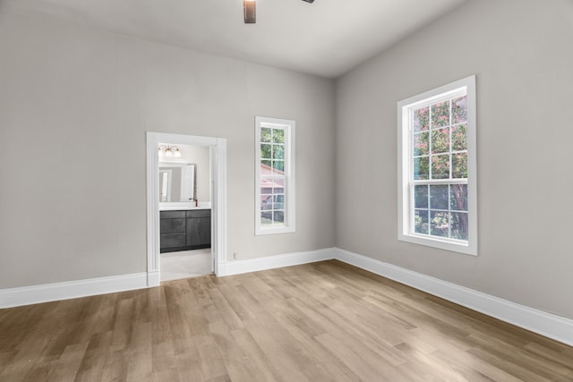 1315 E Pecan St, Gainesville, TX 76240 - empty room featuring light wood finished floors, a ceiling fan, and baseboards