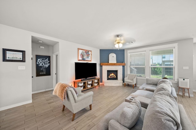 1917 Campground Way, Aubrey, TX 76227 - living area with baseboards, light wood-style flooring, and a fireplace