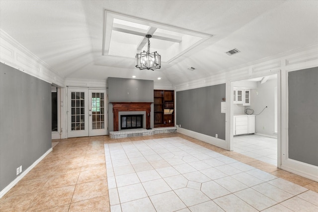 3438 N US Highway 271, Mount Pleasant, TX 75455 - unfurnished living room with light tile patterned flooring, a chandelier, ornamental molding, french doors, and baseboards