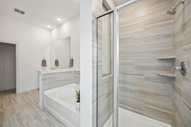 424 Somerville Dr, Mckinney, TX 75071 - bathroom featuring a shower stall, a bath, and recessed lighting