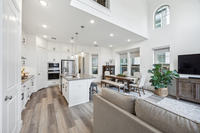 424 Somerville Dr, Mckinney, TX 75071 - living area with wood finished floors and recessed lighting