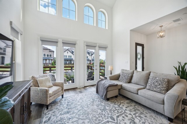 424 Somerville Dr, Mckinney, TX 75071 - living area with a towering ceiling and wood finished floors