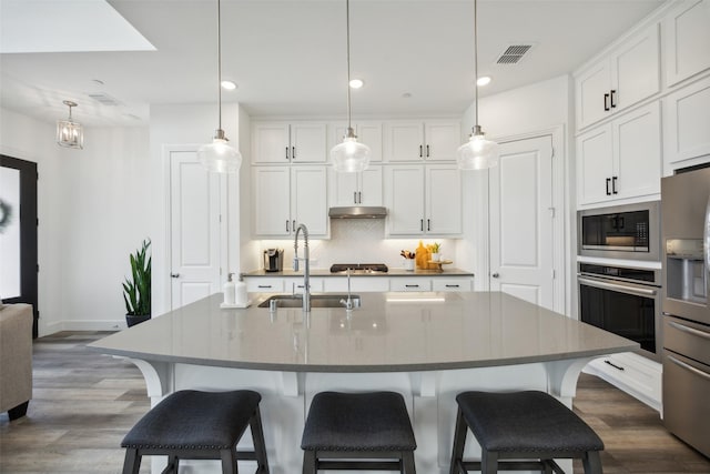 424 Somerville Dr, Mckinney, TX 75071 - kitchen featuring stainless steel appliances, a sink, backsplash, white cabinetry, and recessed lighting